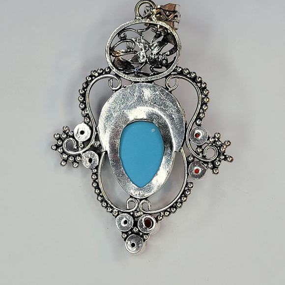 Sterling Silver Pendant with Blue Carved Face and Garnet Accents - Picture 7 of 12